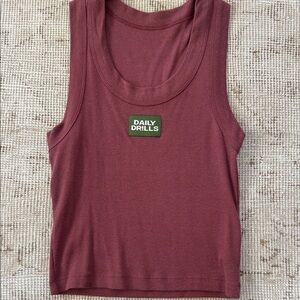 Daily Drills
LOGO RIBBED TANK
XS/S
Wine